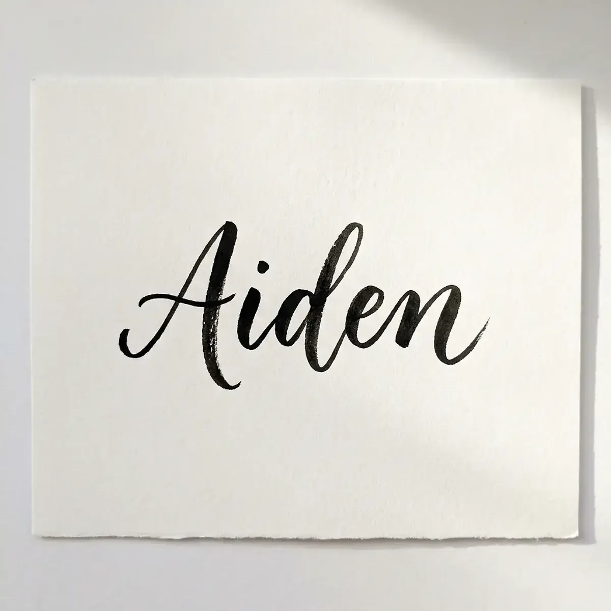 The name Aiden in elegant calligraphy