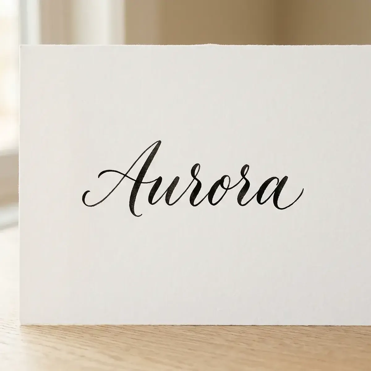 The name Aurora in elegant calligraphy