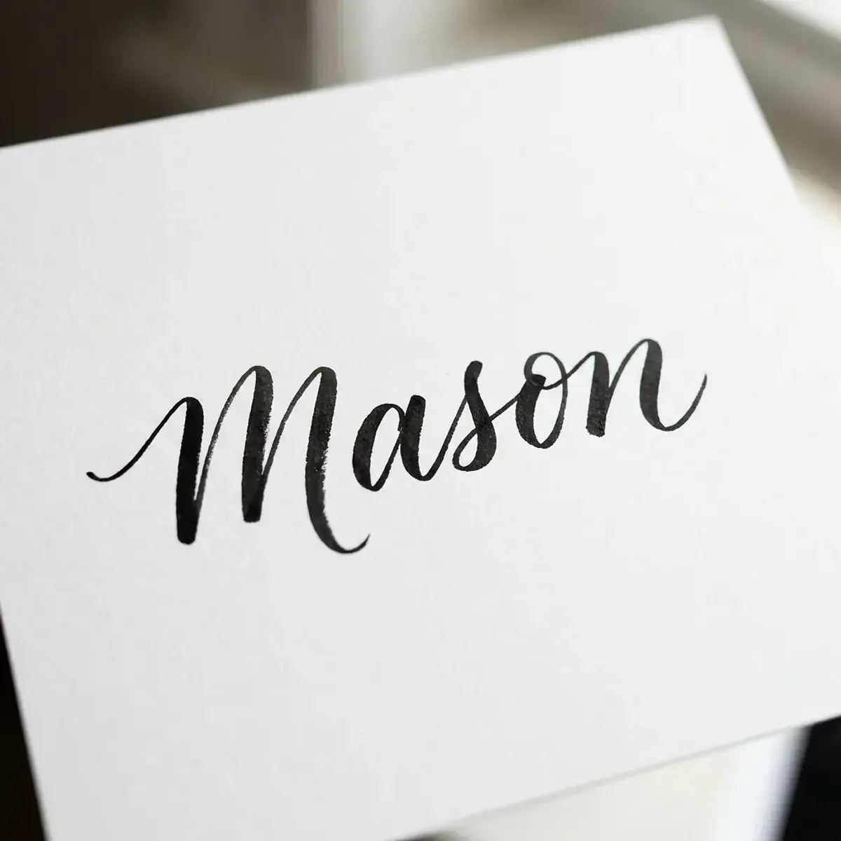 The name Mason in elegant calligraphy