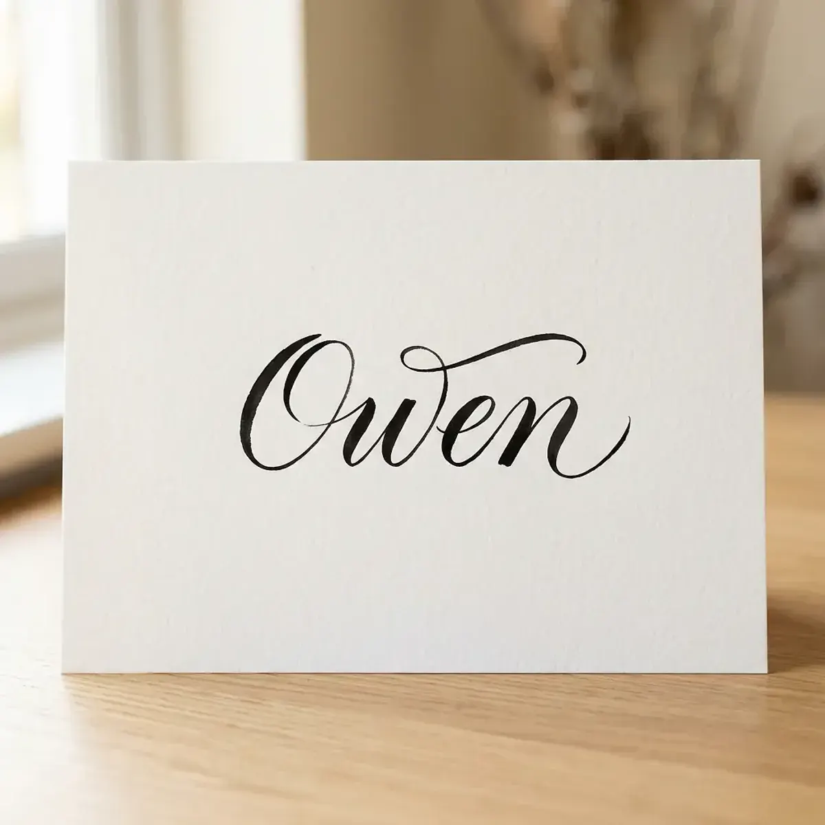 The name Owen in elegant calligraphy