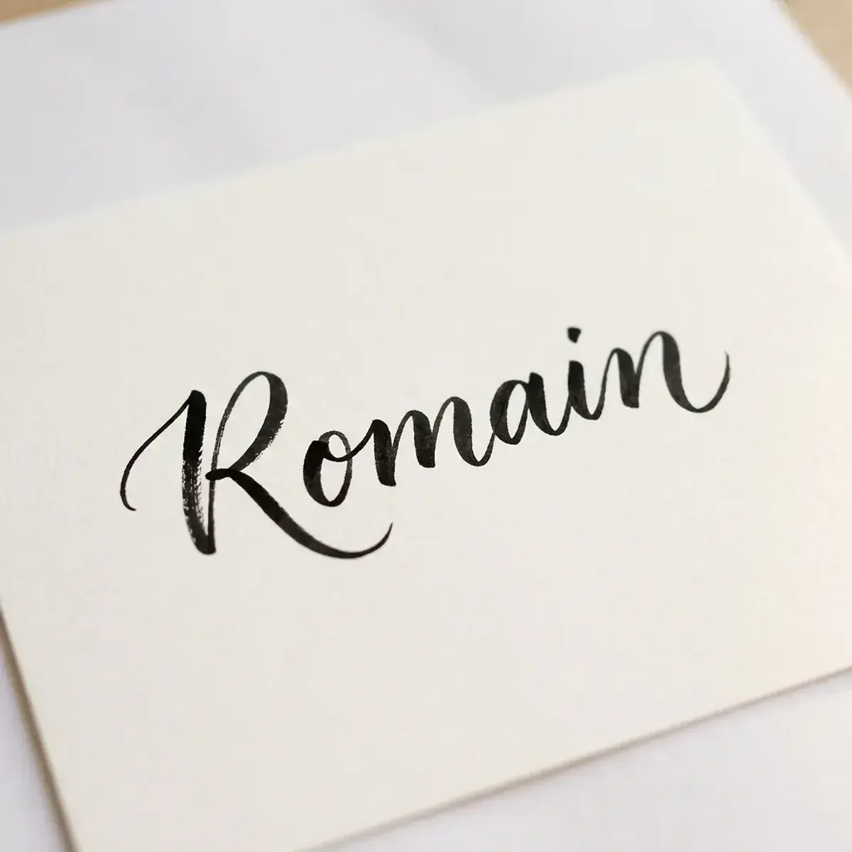 Le prénom Romain en calligraphie