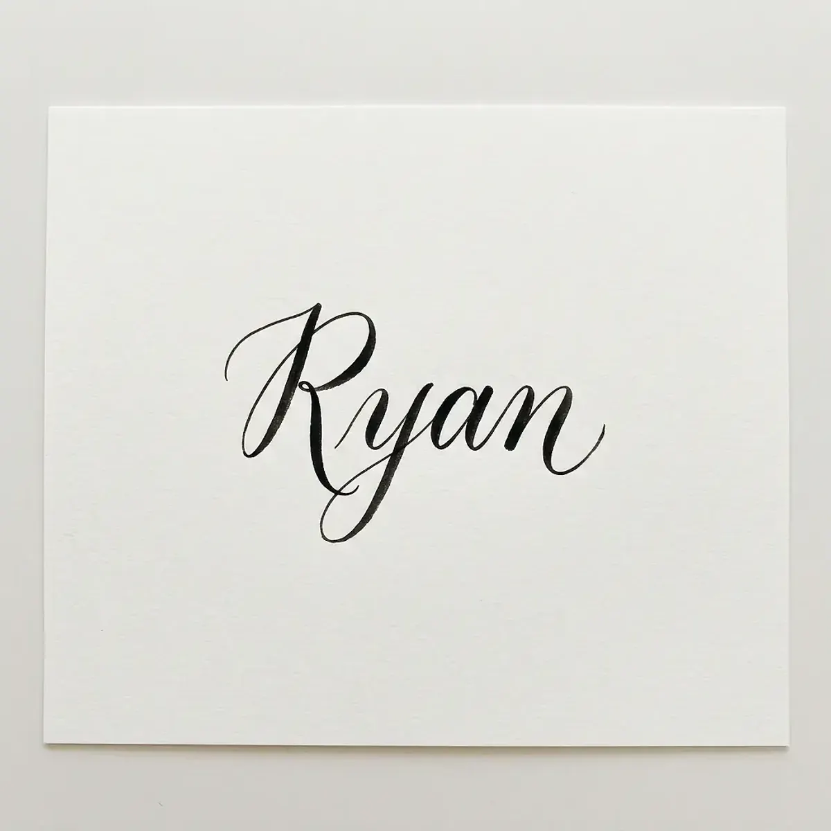 The name Ryan in elegant calligraphy